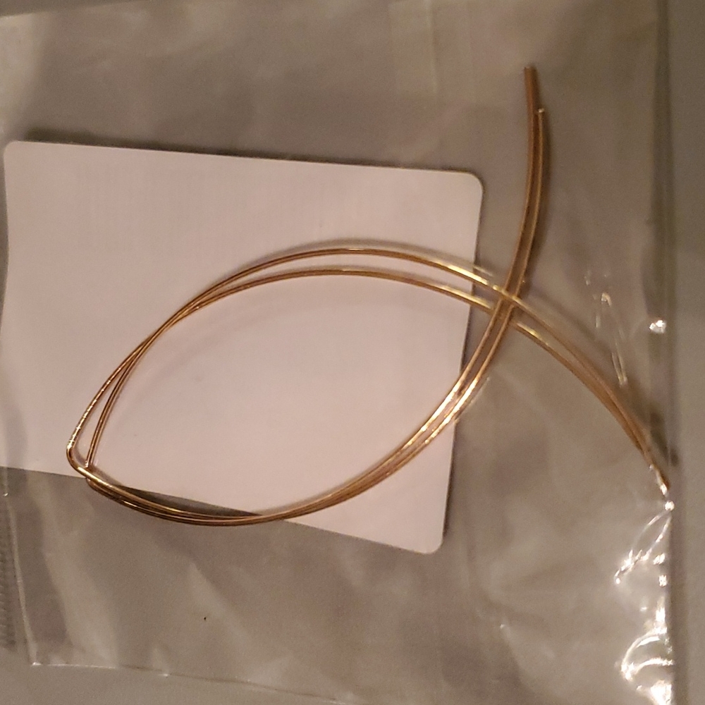 NWT Goldtone fish shape earrings.